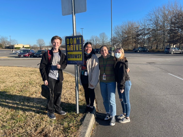 Youth Ambassadors hang up a "Don't Drive Drowsy" sign at Oak Ridge High School in an attempt to reduce teen crashes.